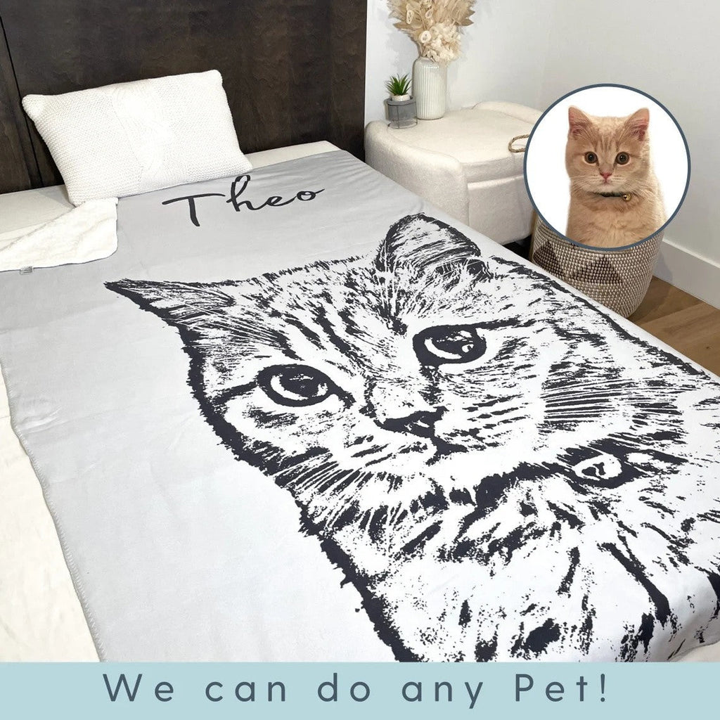 Personalized pet portrait blanket with a cat portrait and the name Theo on a bed